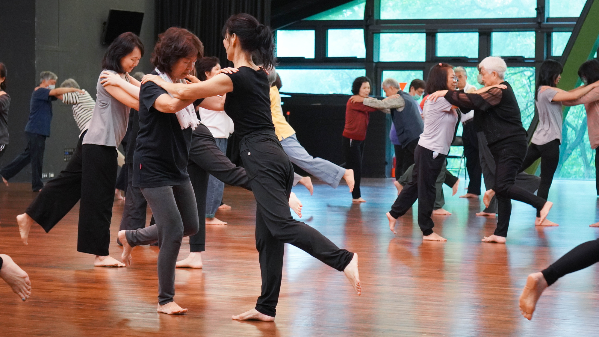 Participants engaging in paired interactive movement